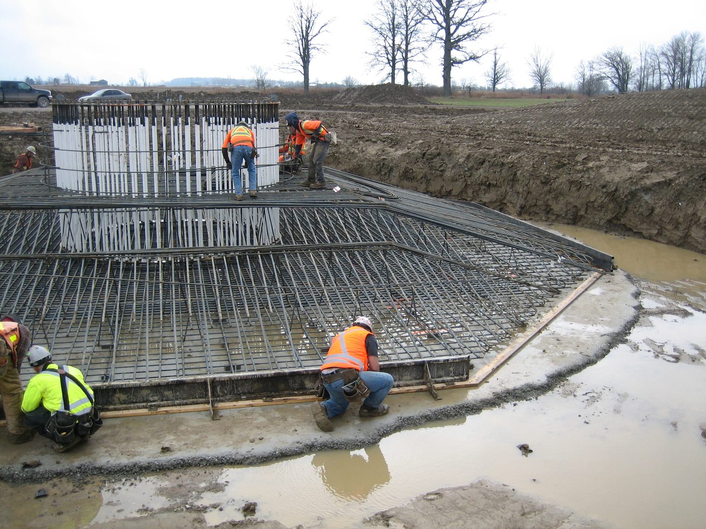 Reinforcing steel placed across a twenty-metre diameter spread footing before the concrete pour.